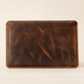 Distressed brown handmade leather MacBook sleeve — front view
