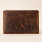Distressed brown handmade leather MacBook sleeve — front view