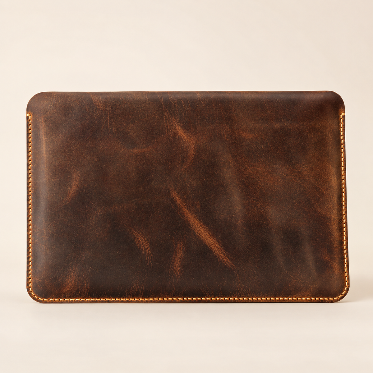Distressed brown handmade leather MacBook sleeve — front view