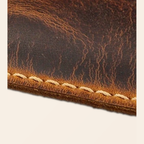 Close-up of distressed top grain brown leather texture