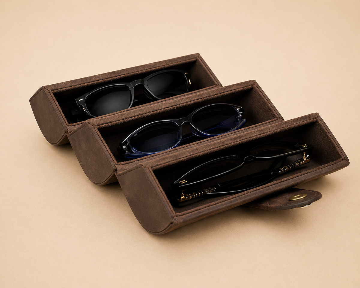 Leather sunglasses case shown open with velvet-lined slots