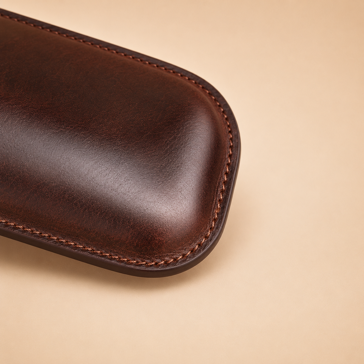 Close-up of cutter slot detail on an adjustable leather cigar case