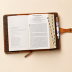 Floral embossed leather Bible cover shown closed, full-grain handcrafted
