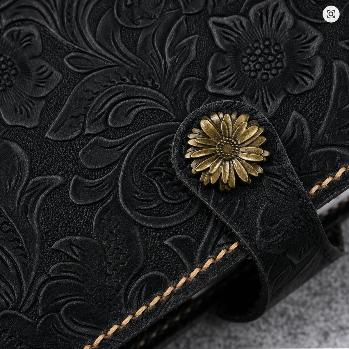 Black floral leather Bible cover shown open, full-grain handcrafted detail