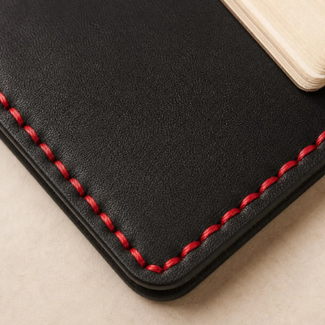 Leather Bible cover shown closed, full-grain construction with custom engraving option