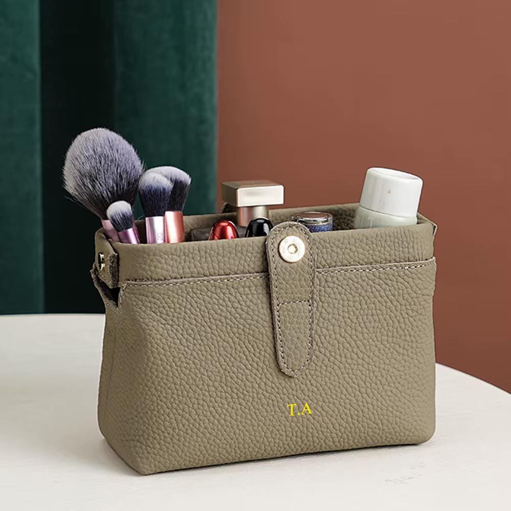 Custom engraving detail on a leather makeup bag