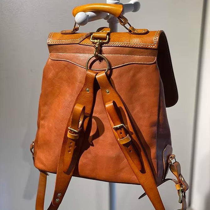 Leather biker backpack shown open with laptop compartment