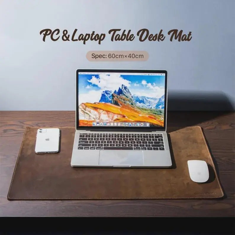 Leather desk mat with mouse and keyboard styled on top