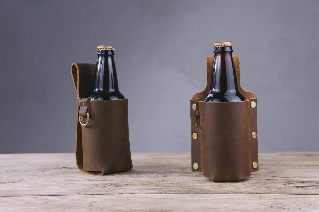 Leather beer holster shown attached to a belt