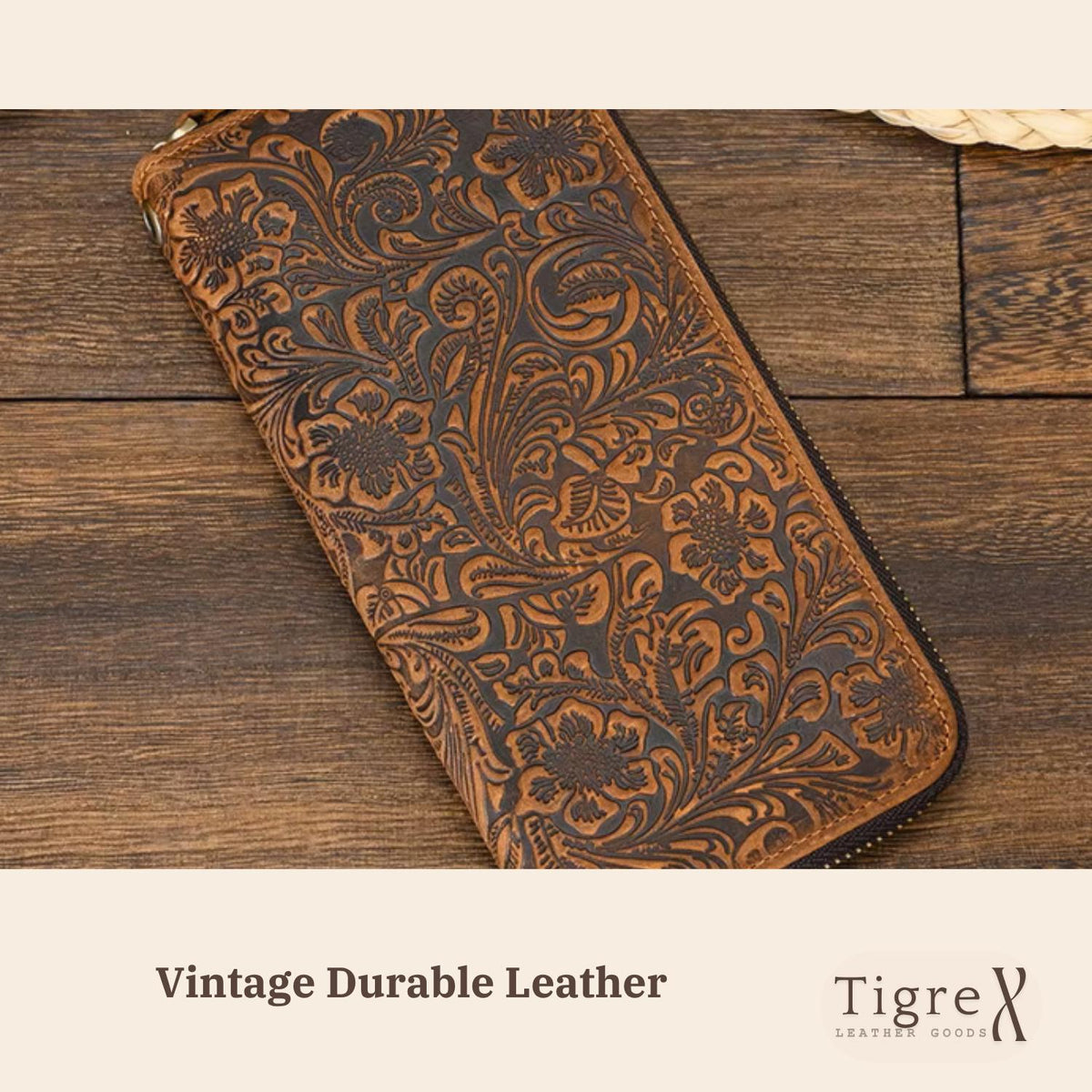 Leather long wallet held in hand, showing zip-around closure