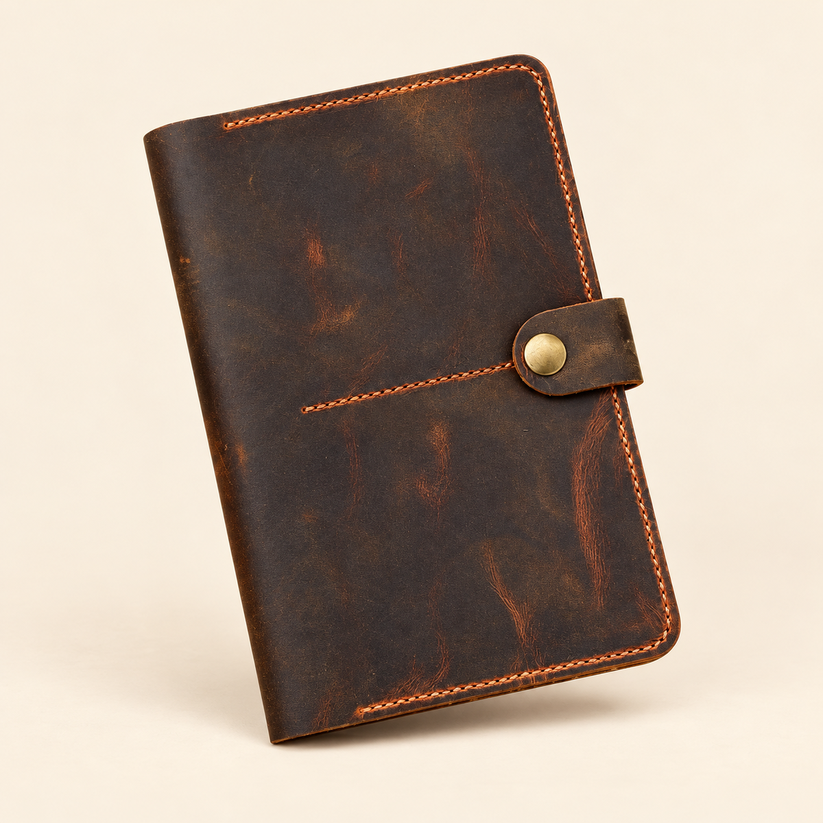 TigreX Studio full-grain leather family passport holder for six passports, distressed brown front view with brass snap closure