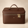 Personalized brown genuine leather cosmetic makeup case with gold zipper and embossed initials, luxury studio hero photo