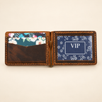 Open distressed full-grain leather wallet with inner card slots and center metal cash clip
